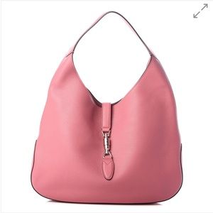 An guaranteed authentic GUCCI Grained Calfskin Large Soft Jackie Hobo in Pink.